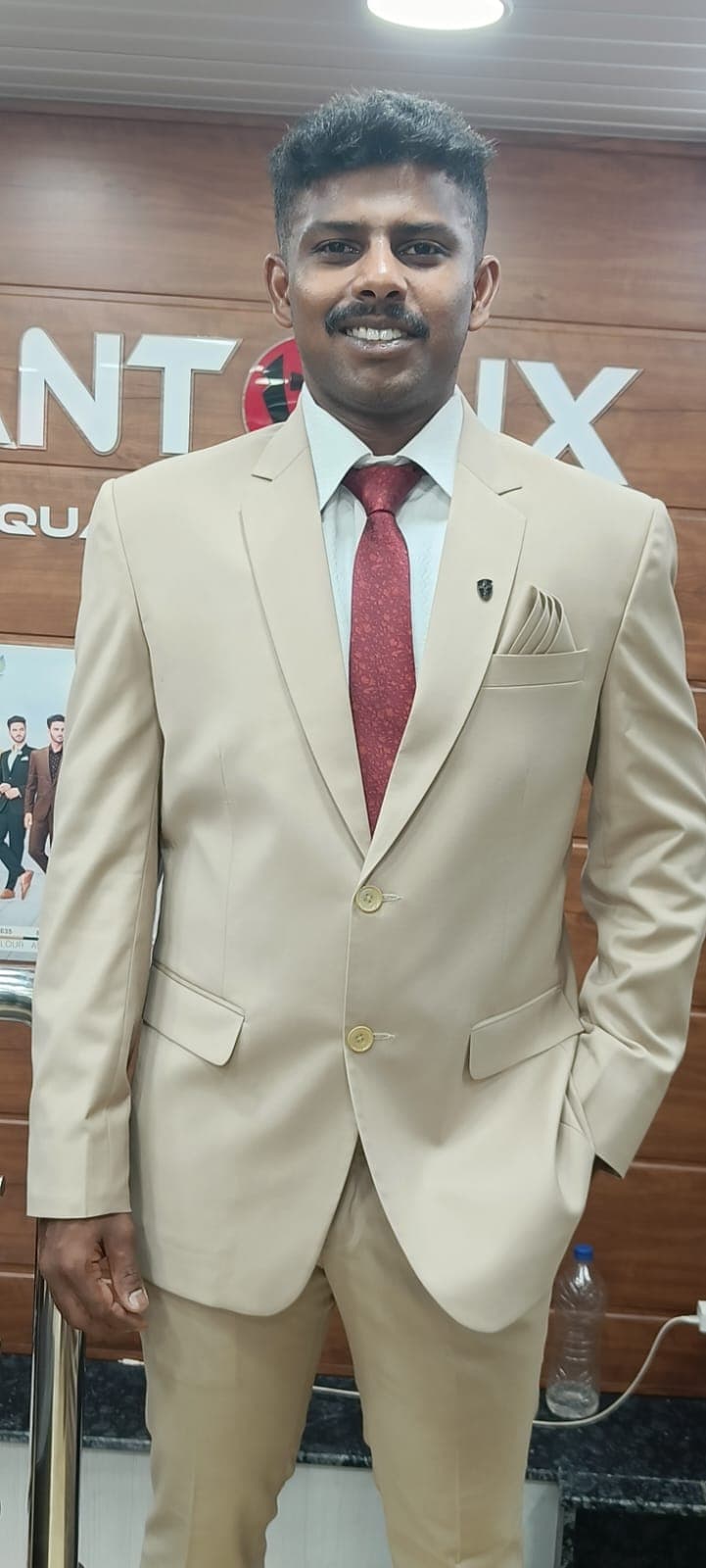 Beige two-piece — Notch lapel · two-button · matched trouser